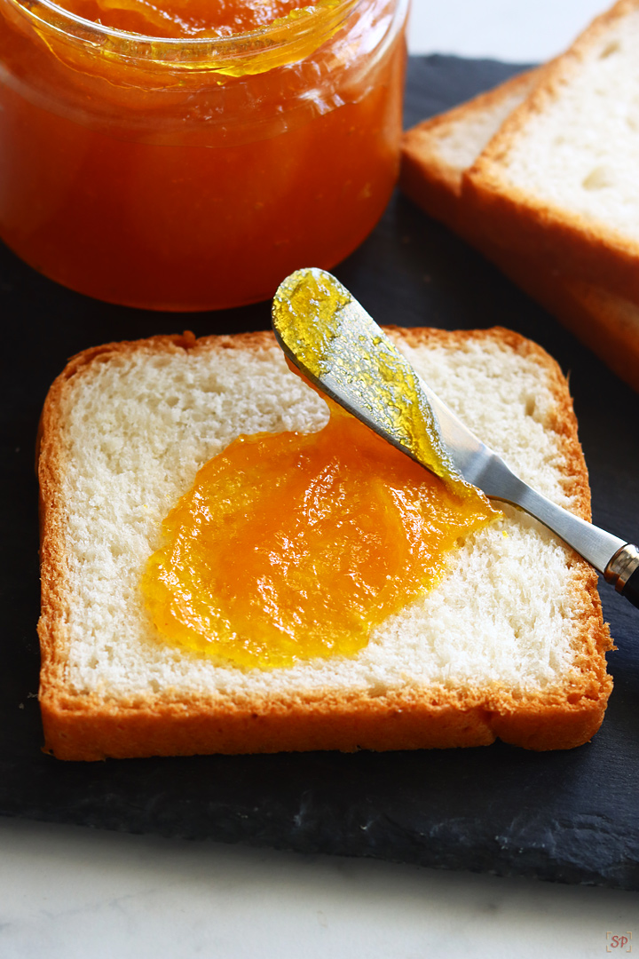 mango jam spread on a bread slice