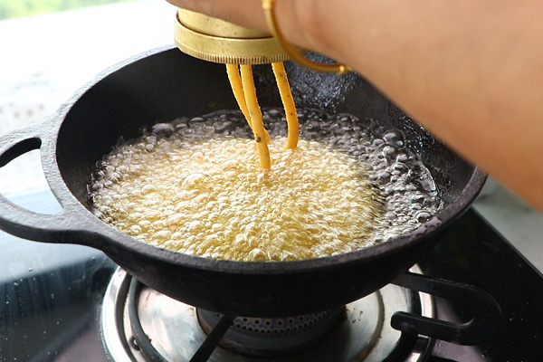 press in hot oil