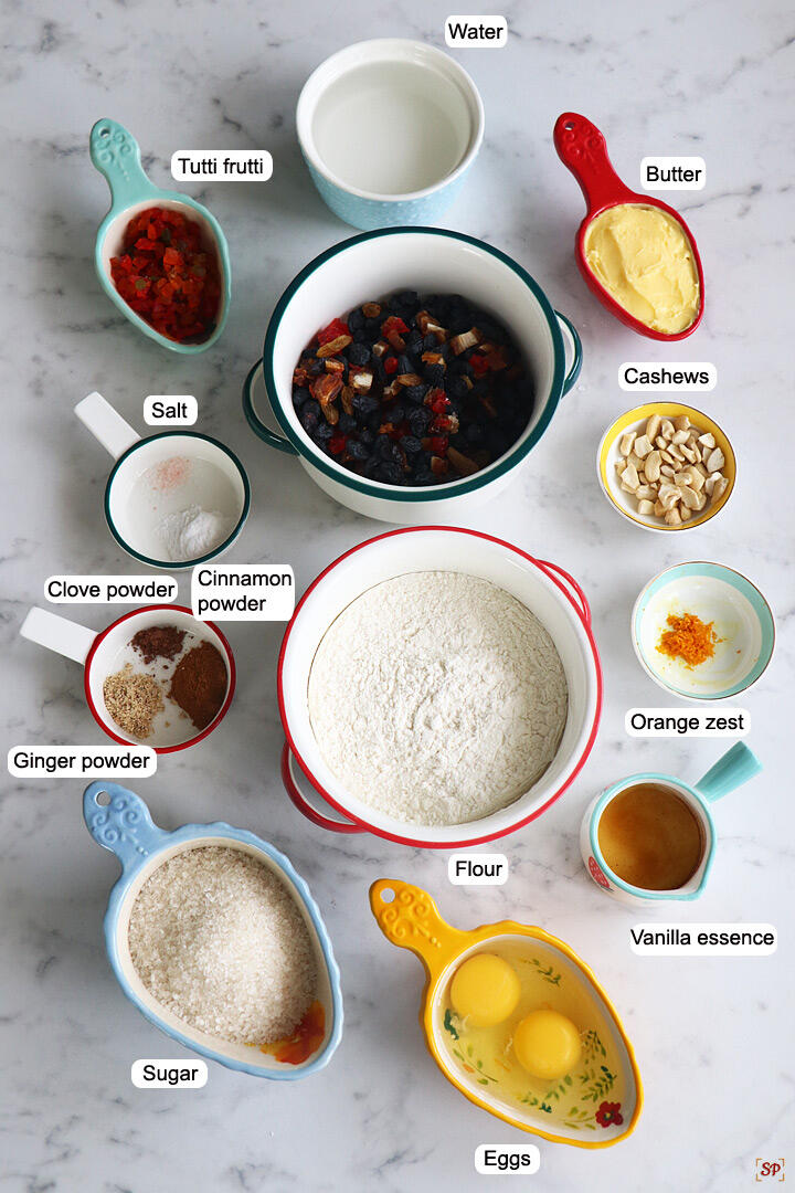 a display of ingredients needed to make plum cake