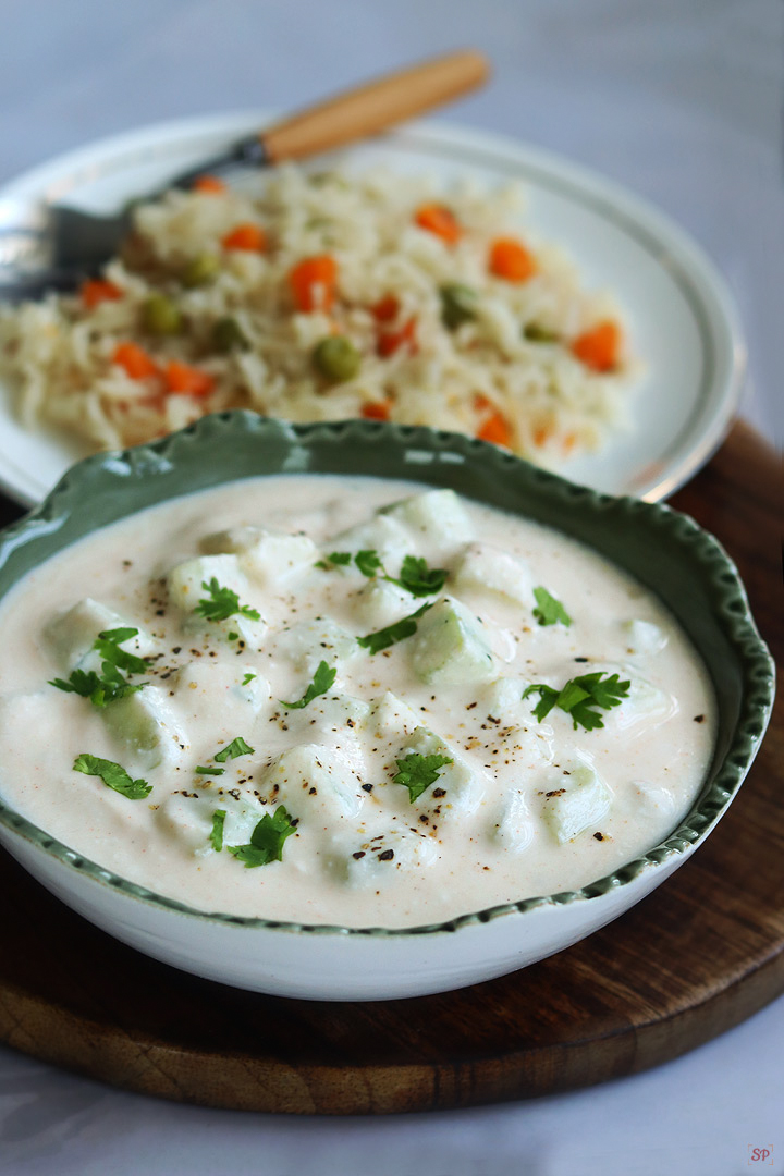 cucumber raita served with vegetable pulao