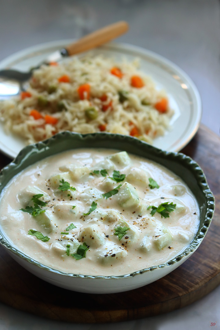 cucumber raita served with vegetable pulao