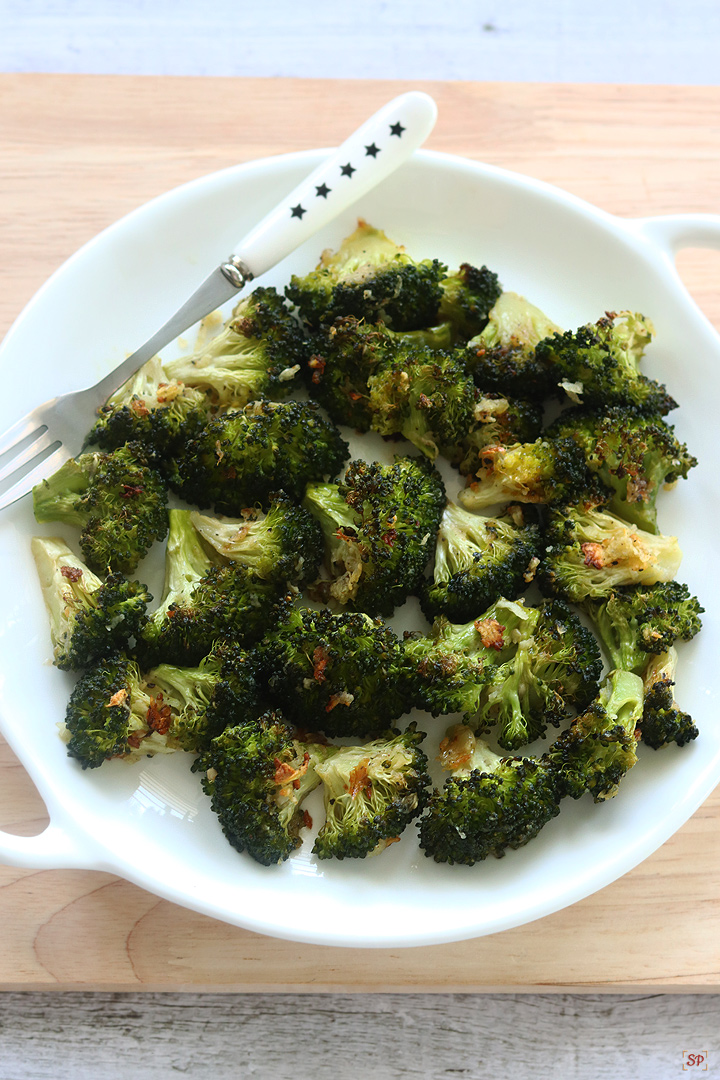 roasted broccoli in a white plate