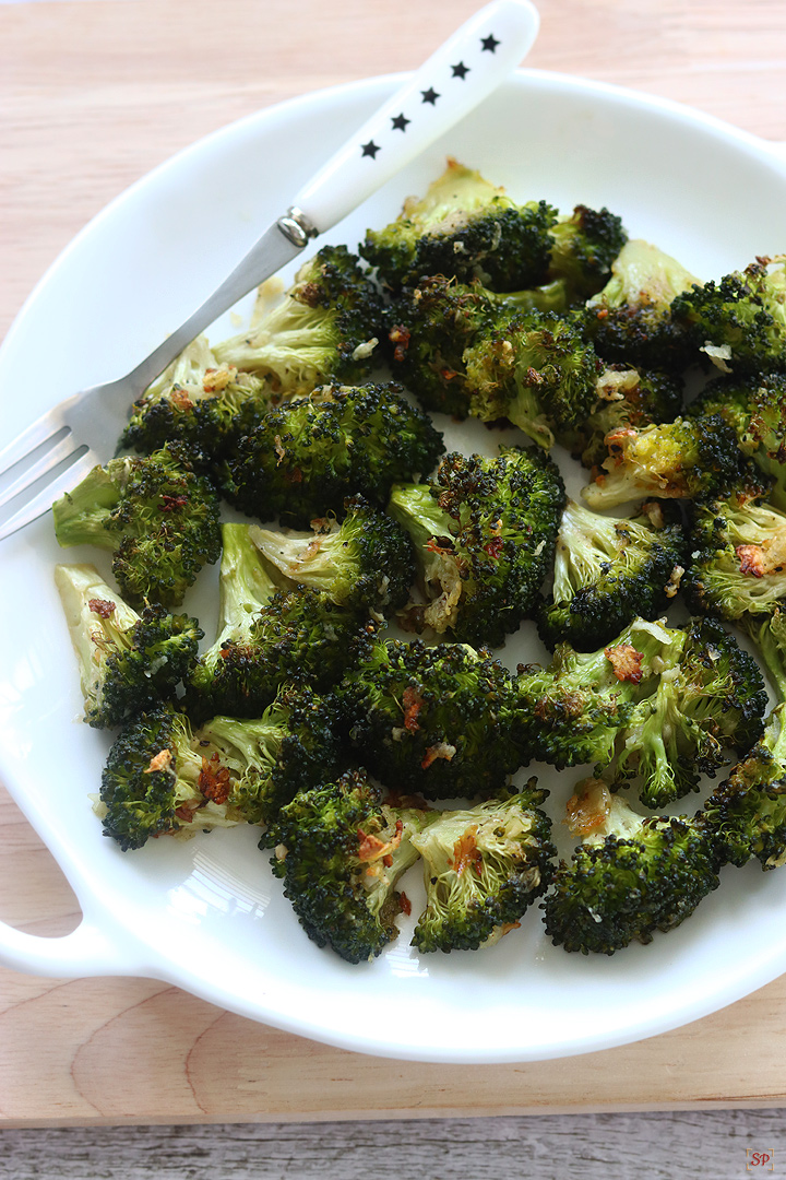 roasted broccoli in a white plate