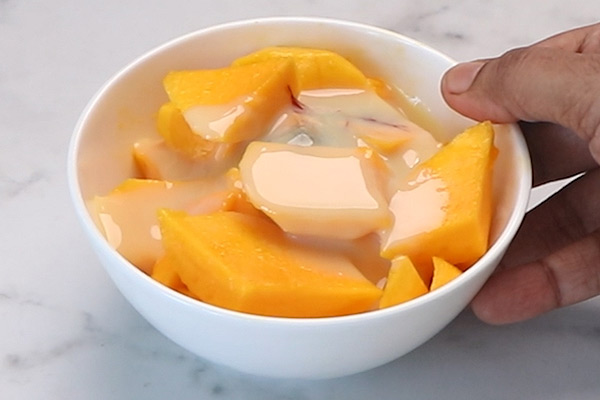 add mangoes, condensed milk