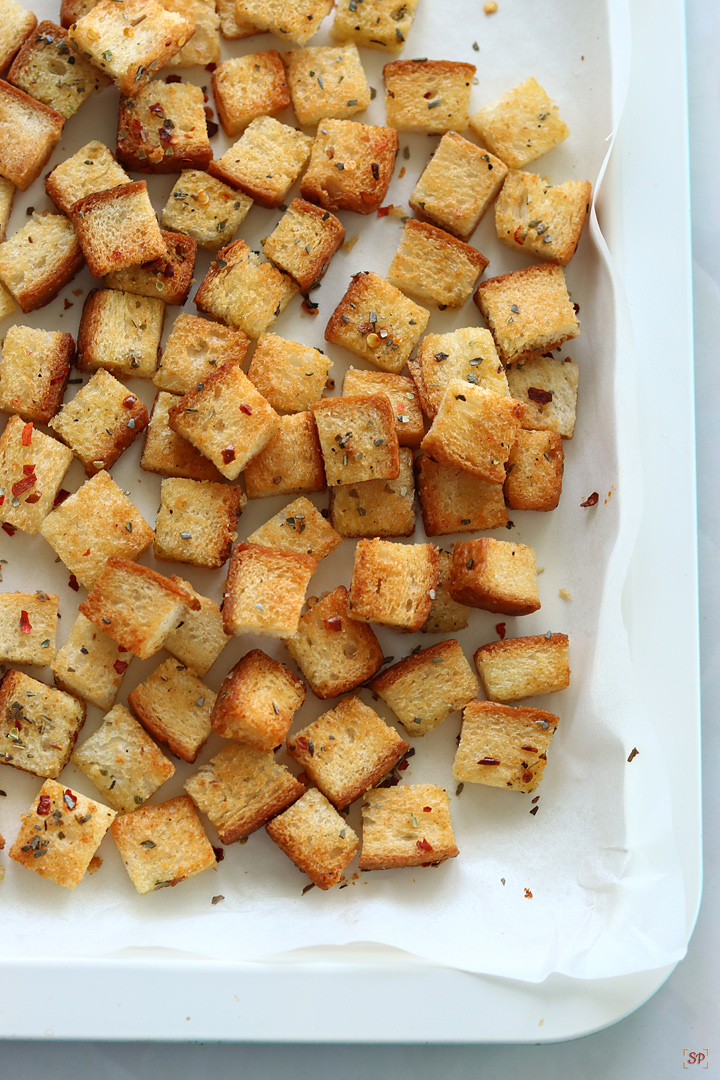 homemade croutons ready in baking tray