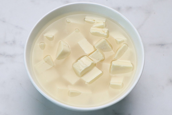 soak paneer in hot water