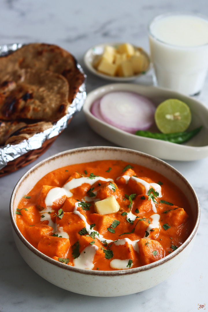 paneer butter masala in a beige color bowl