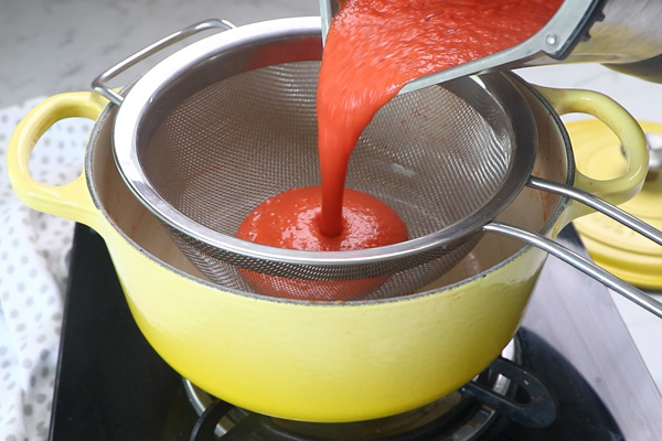 add tomato puree to strainer