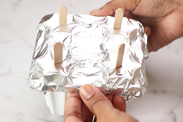 cover with foil, insert ice cream stick
