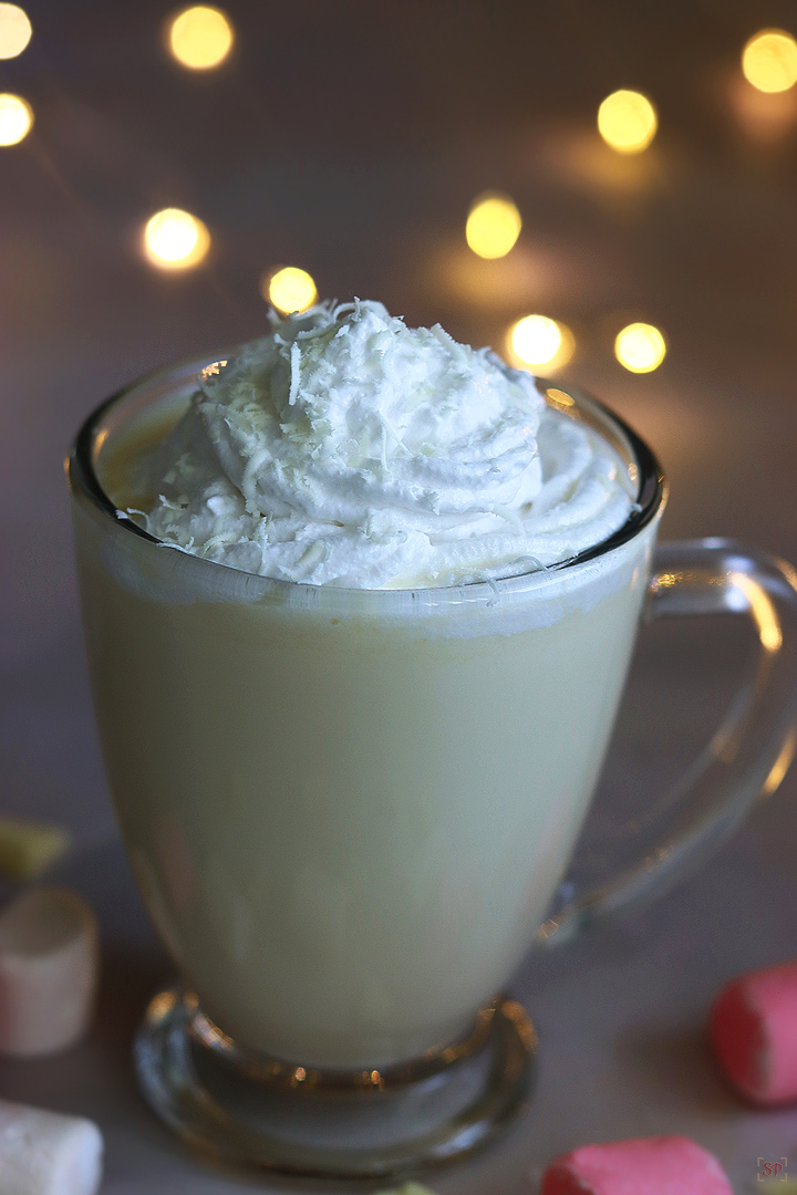 white hot chocolate served in a glass mug