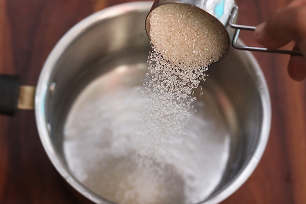 add sugar to a pan with water