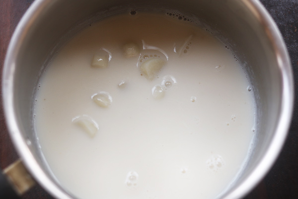 garlic milk served in a ceramic mug