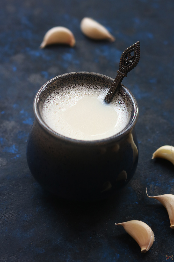 garlic milk served in a ceramic mug