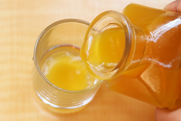 add mango squash to a glass