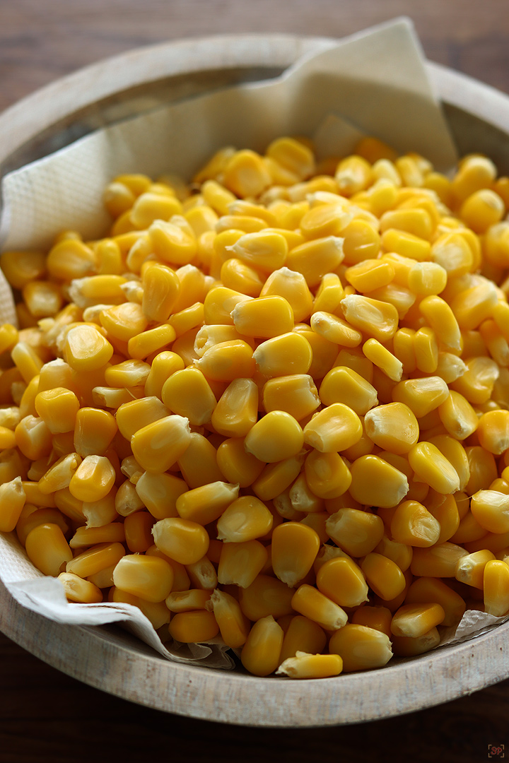 corn kernels in a wooden bowl