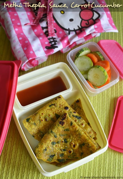 methi thepla with tomato sauce along with carrot cucumber