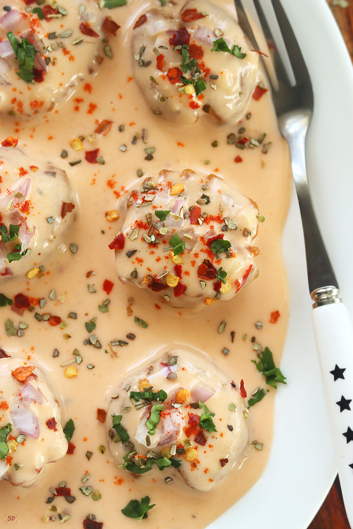 cajun potatoes in a white plate