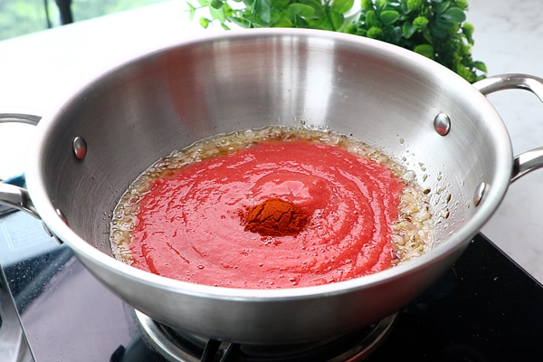 add tomato puree, red chili powder