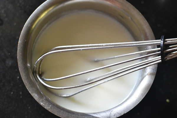 whisk curd with water