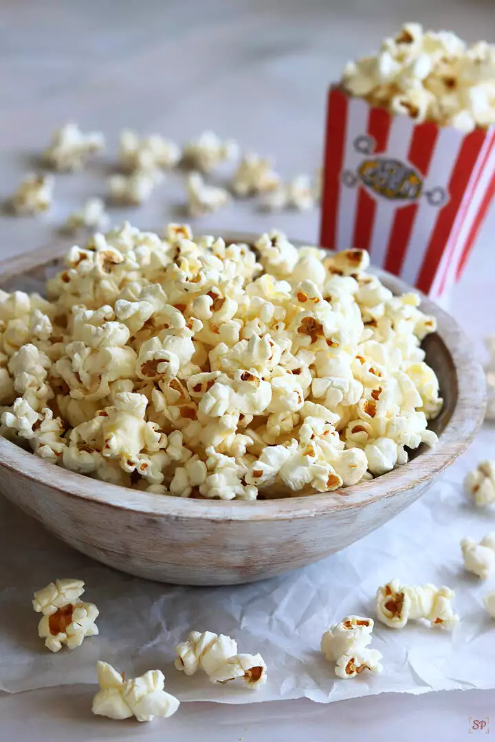 butter popcorn in a wooden bowl