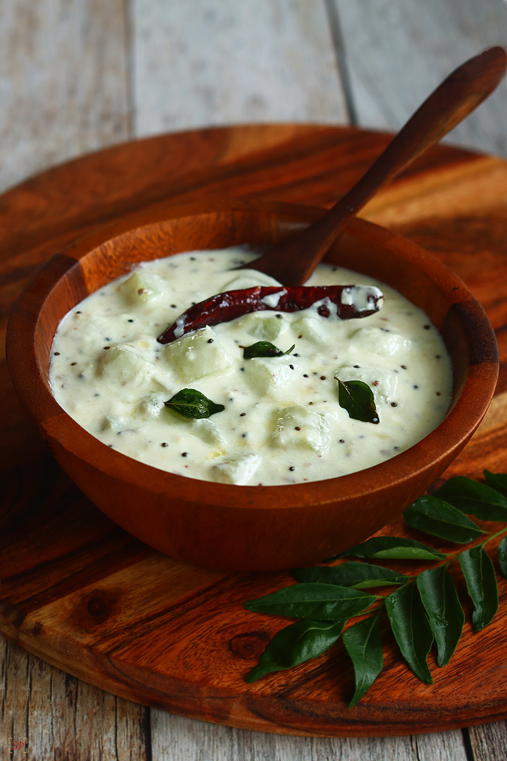 cucumber pachadi in a wooden bowl