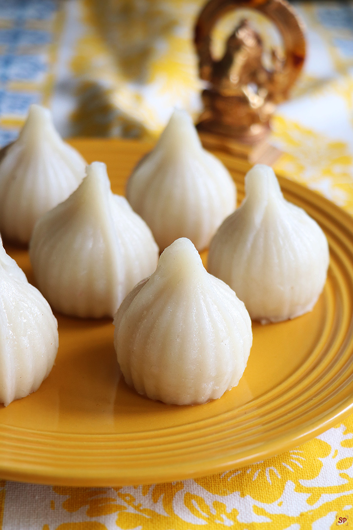 modak served in a yellow plate