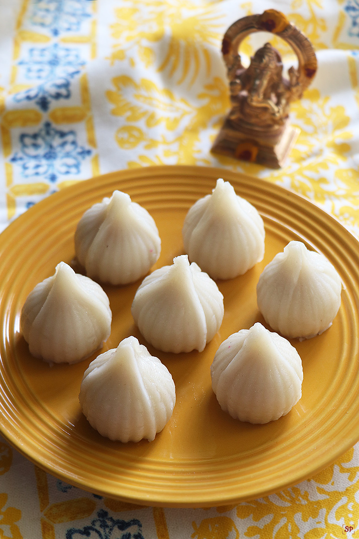 modak served in a yellow plate