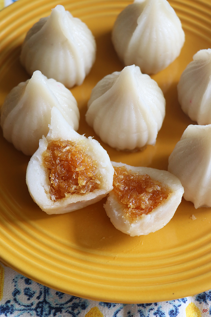 modak served in a yellow plate