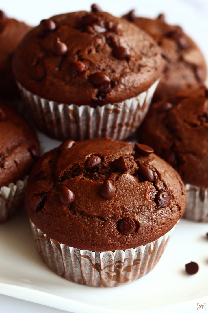 chocolate muffins arranged in a white plate