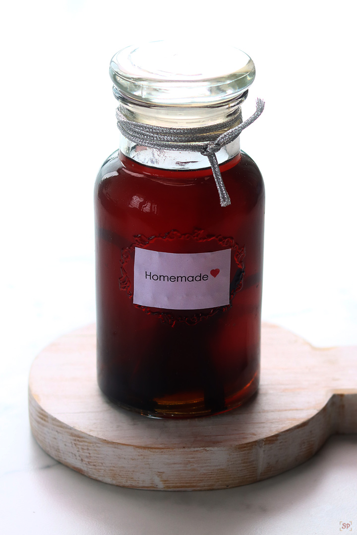 homemade vanilla extract in a glass jar