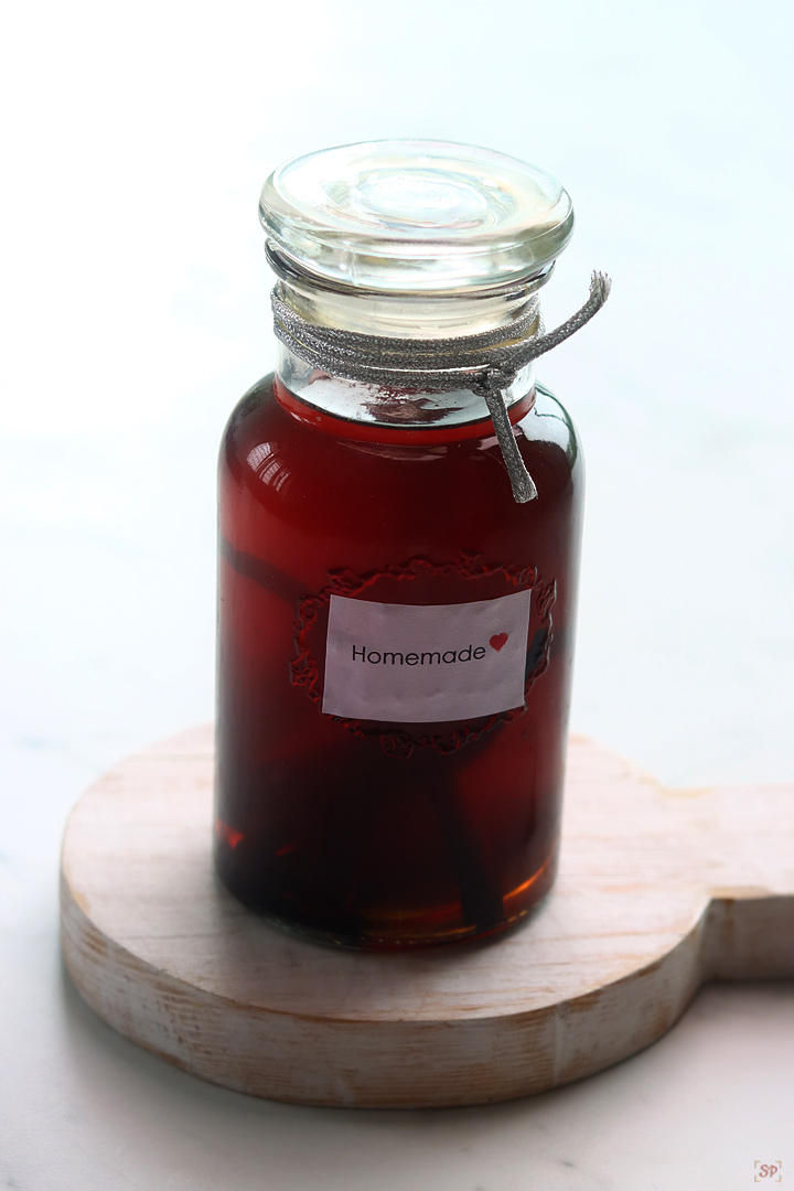 homemade vanilla extract in a glass jar