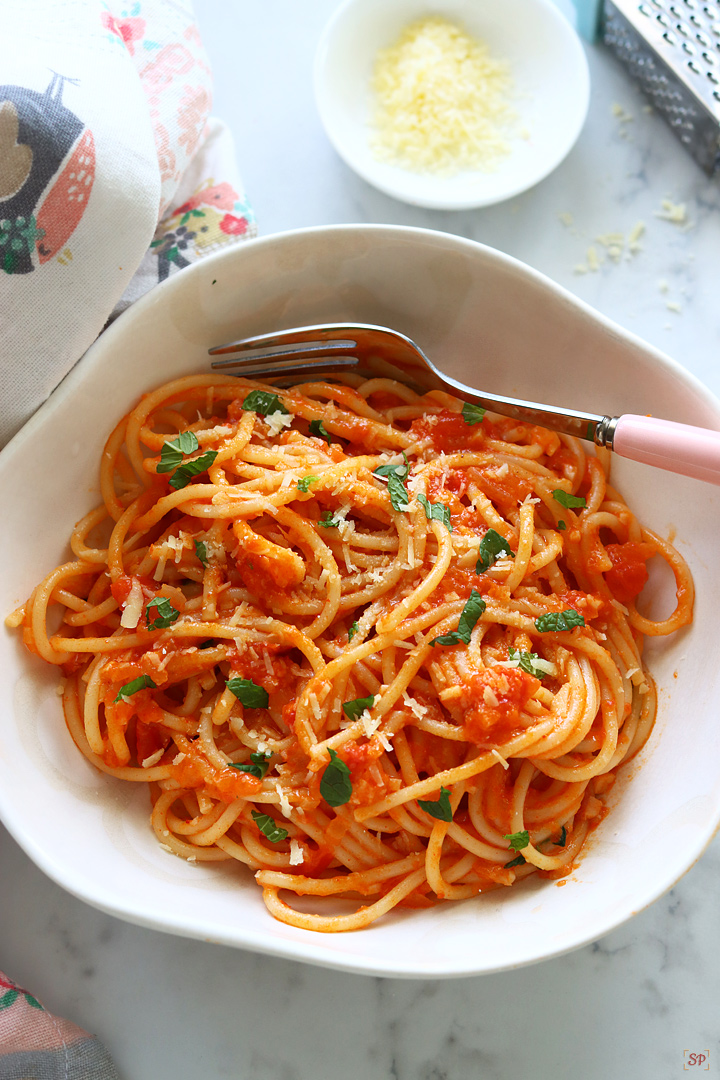 pasta pomodoro served in a white pasta bowl