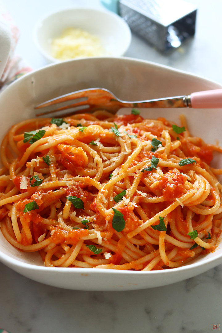 pasta pomodoro served in a white pasta bowl