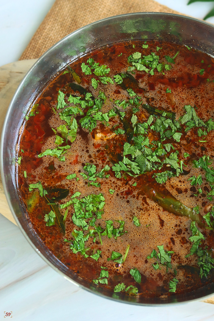 rasam served in a steel bowl