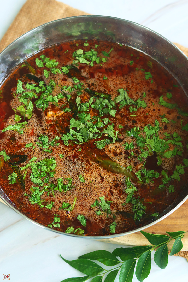 rasam served in a steel bowl