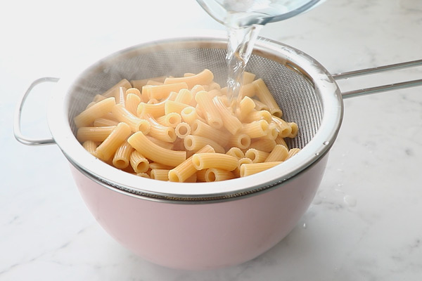 drain pasta, rinse with water